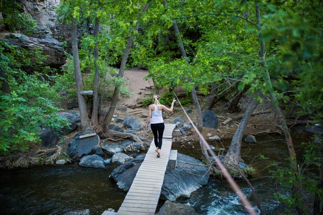 Crossing the log bridge over the creek in Crawdad Canyon