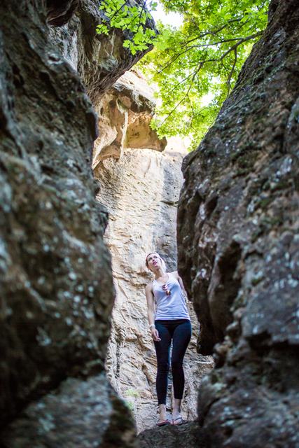 Walking through a narrow gap in the canyon walls