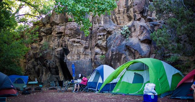 Tents pitched along the river in Crawdad Canyon