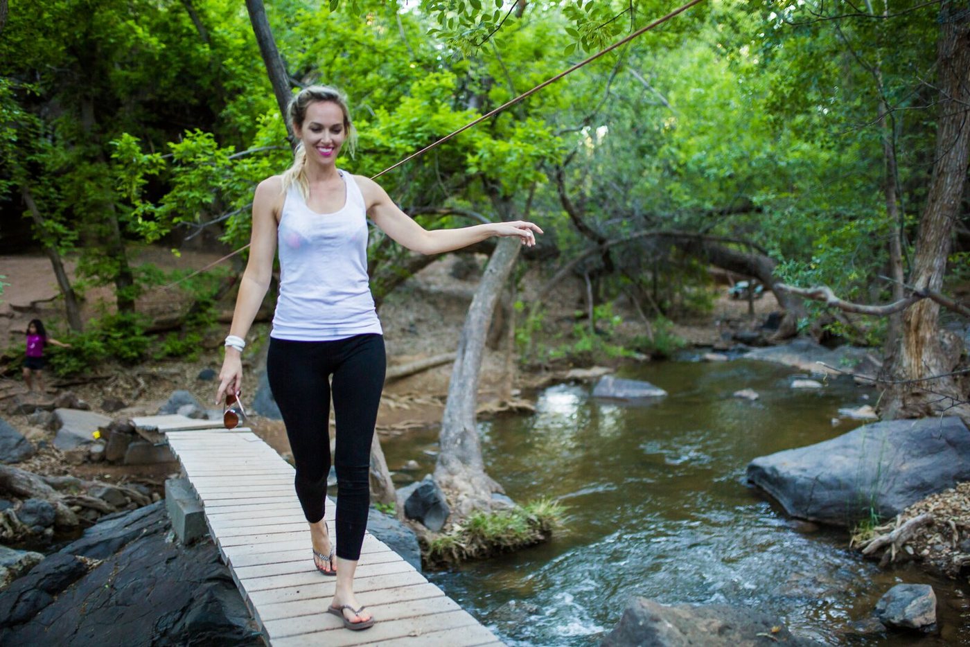 Crossing the log bridge over the creek